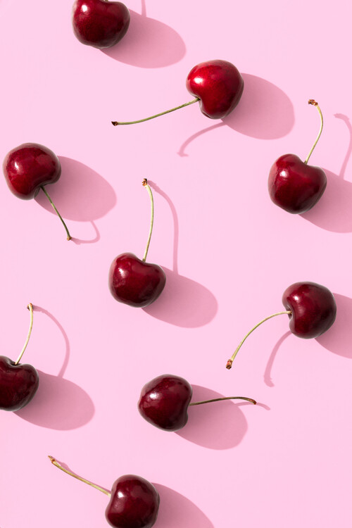 Poster Cherries on pink background