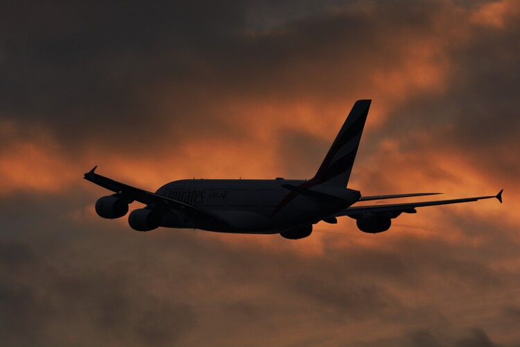 Poster An A380 silhouetted against the evening sky