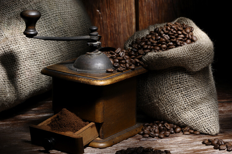 Plakát Coffee beans in a jute bag with a grinder