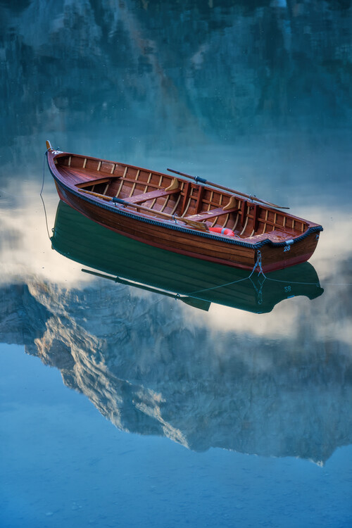 Poster Floating: a boat on a lake in the Dolomites