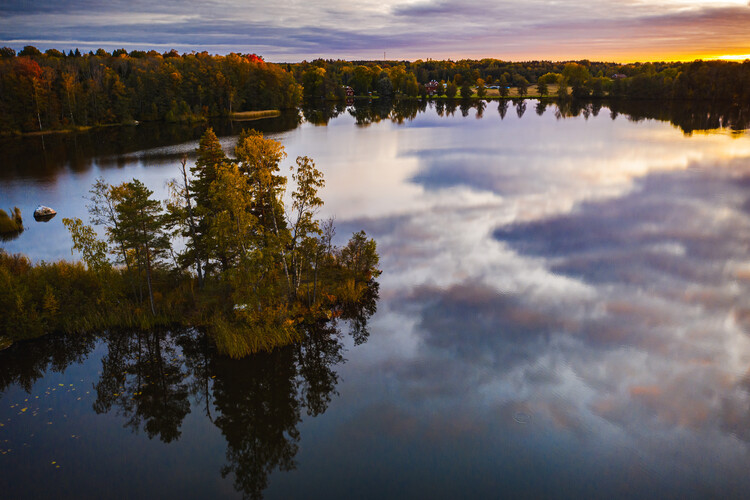 Poster Drone view of sunset over lake