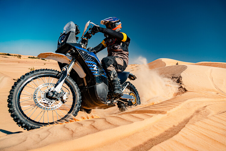 Poster Motorbiker Riding Through Sand Dunes, Wide Shot